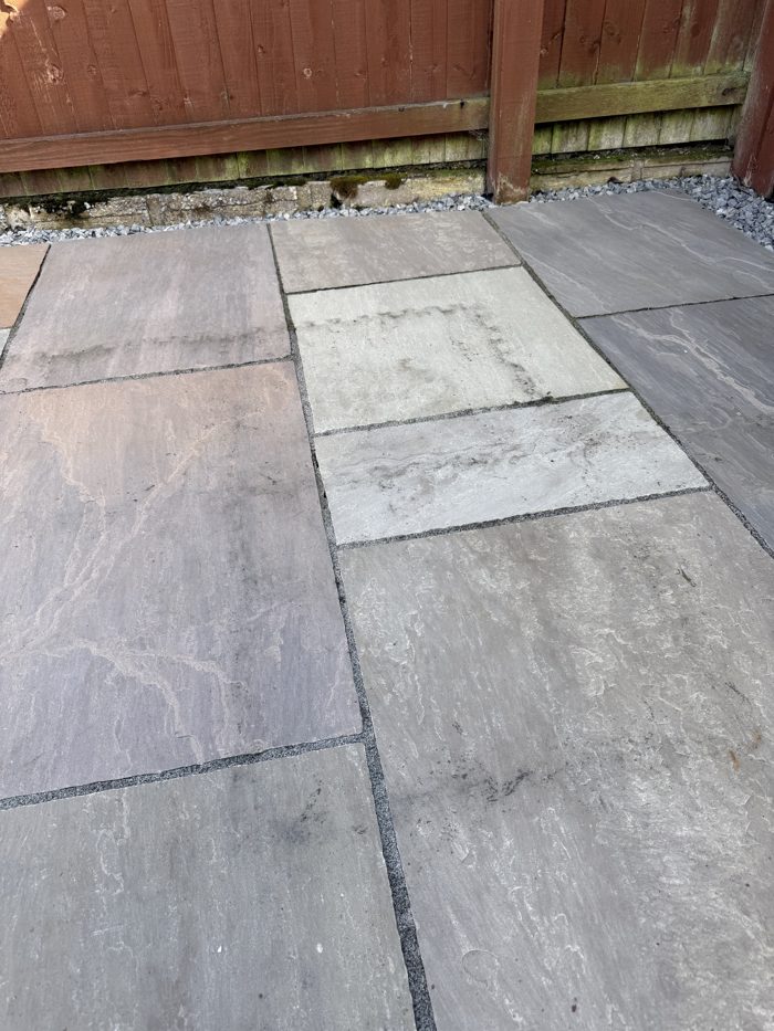 Sandstone patio before cleaning